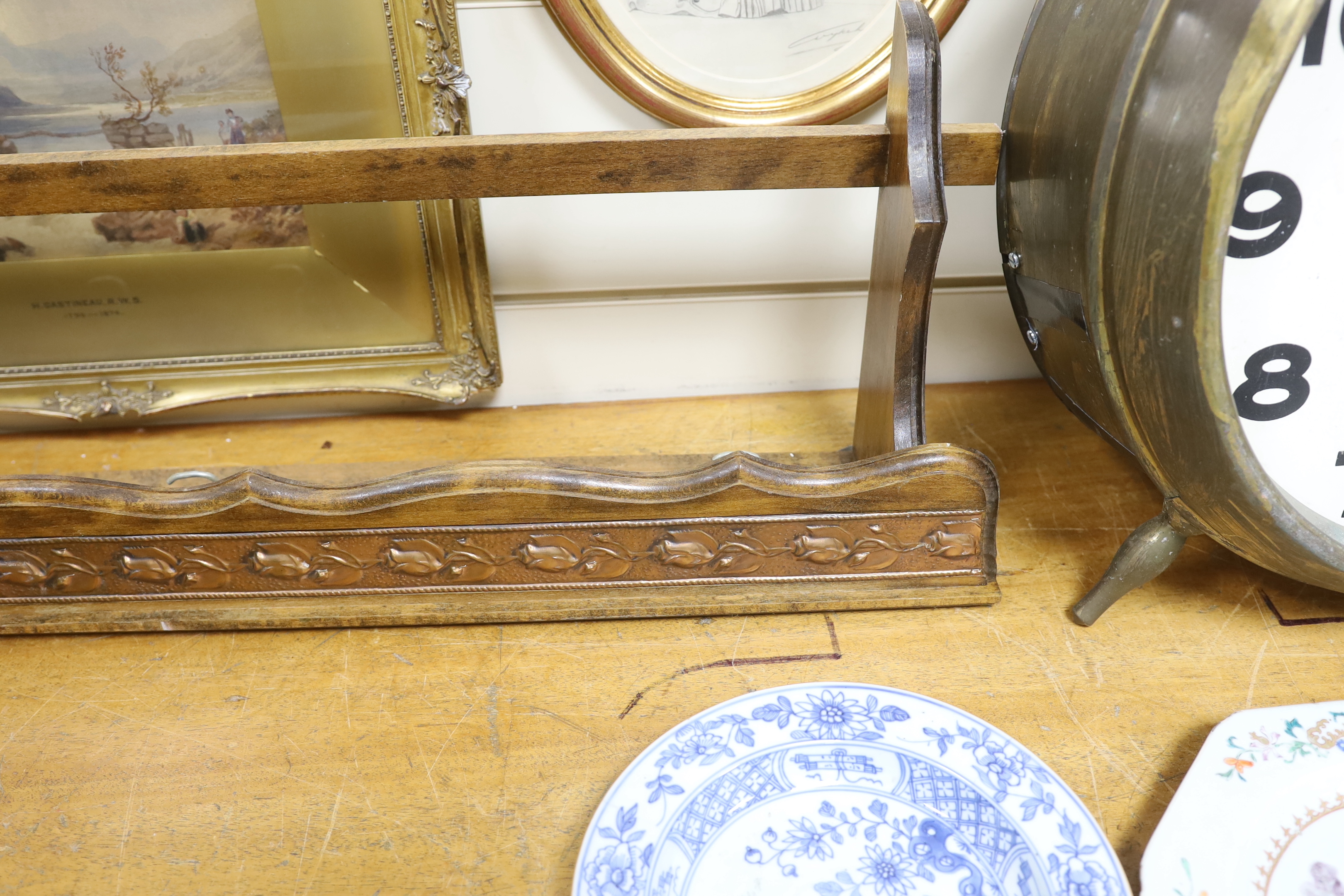 A graduated set of six copper and brass saucepans with beech hanging rack, 104cm wide